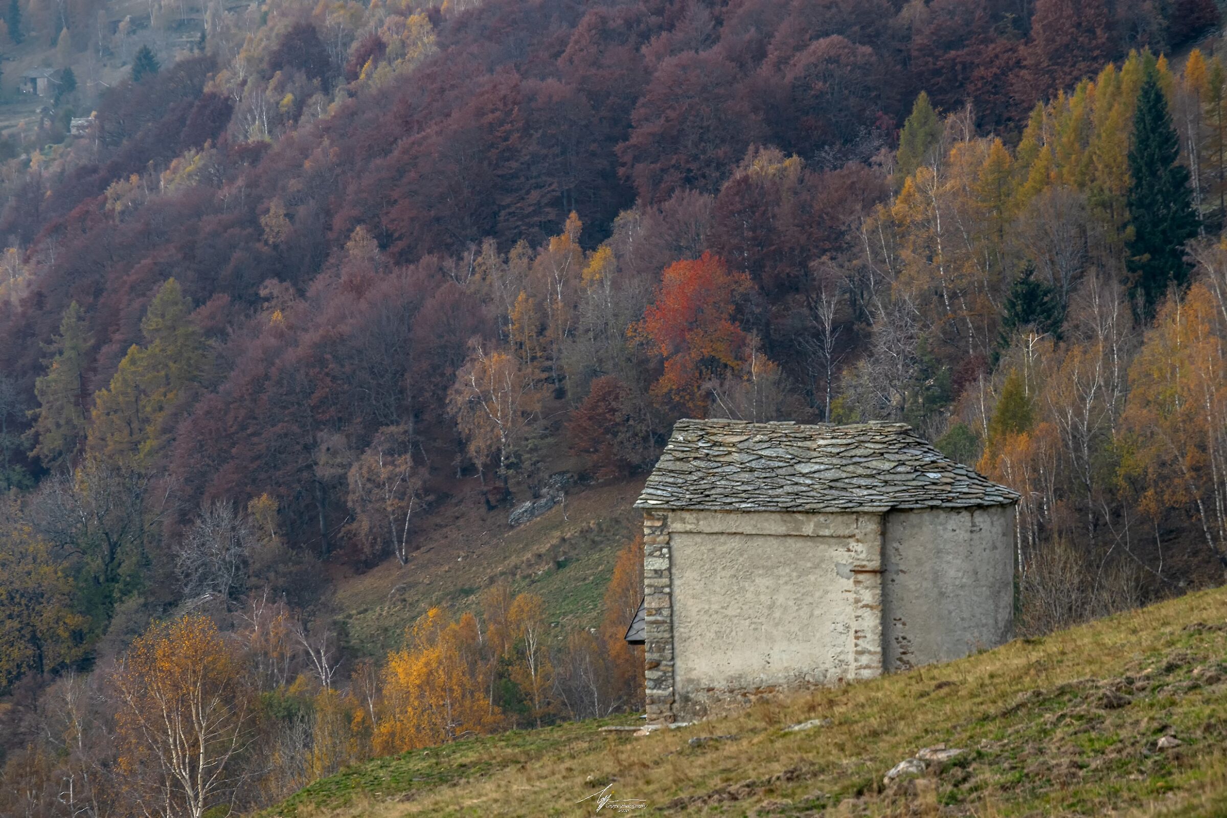 Mountain chapel and landscape in autumn...