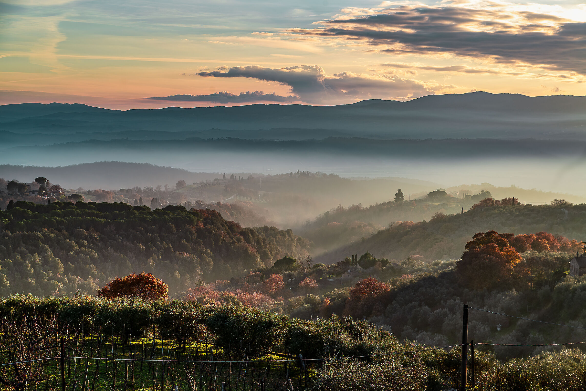 landscape in the evening fog at sunset between Umbria and ...