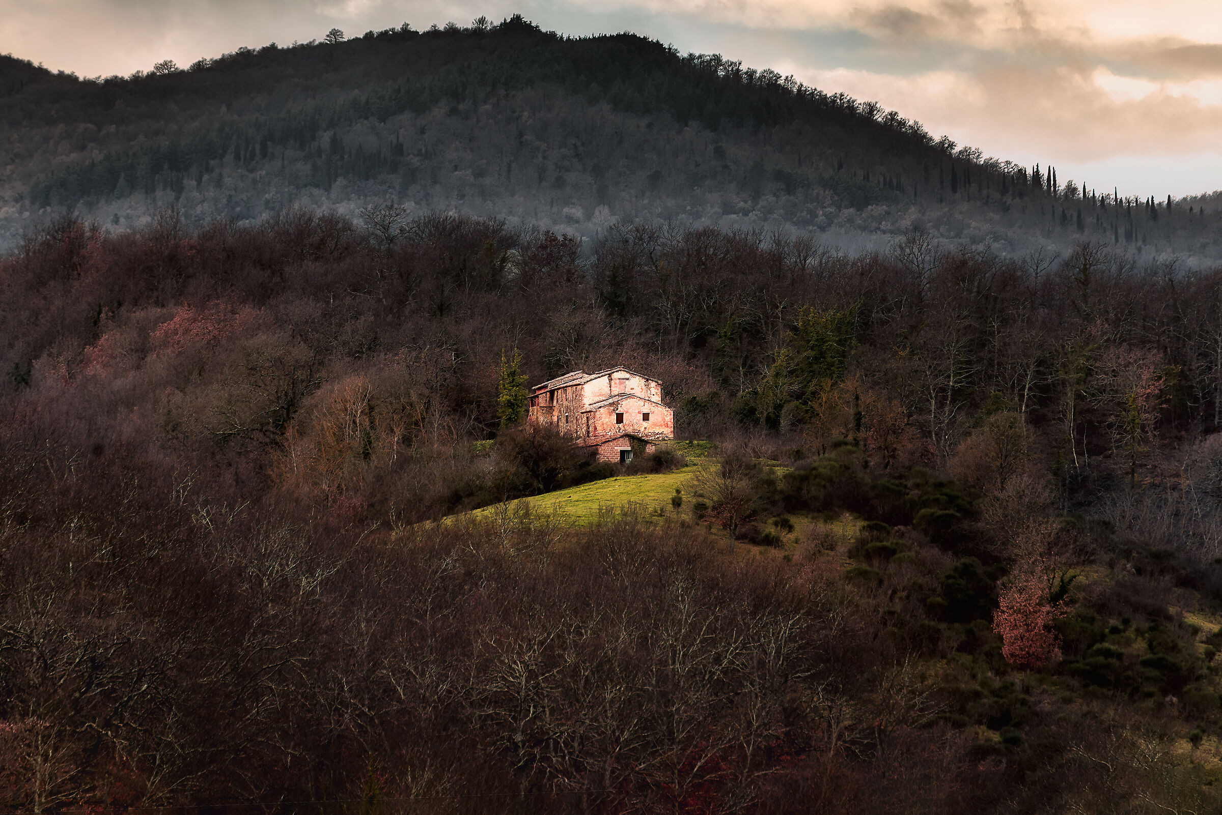 abandoned farmhouse in umbrian countryside on Tuscan background...