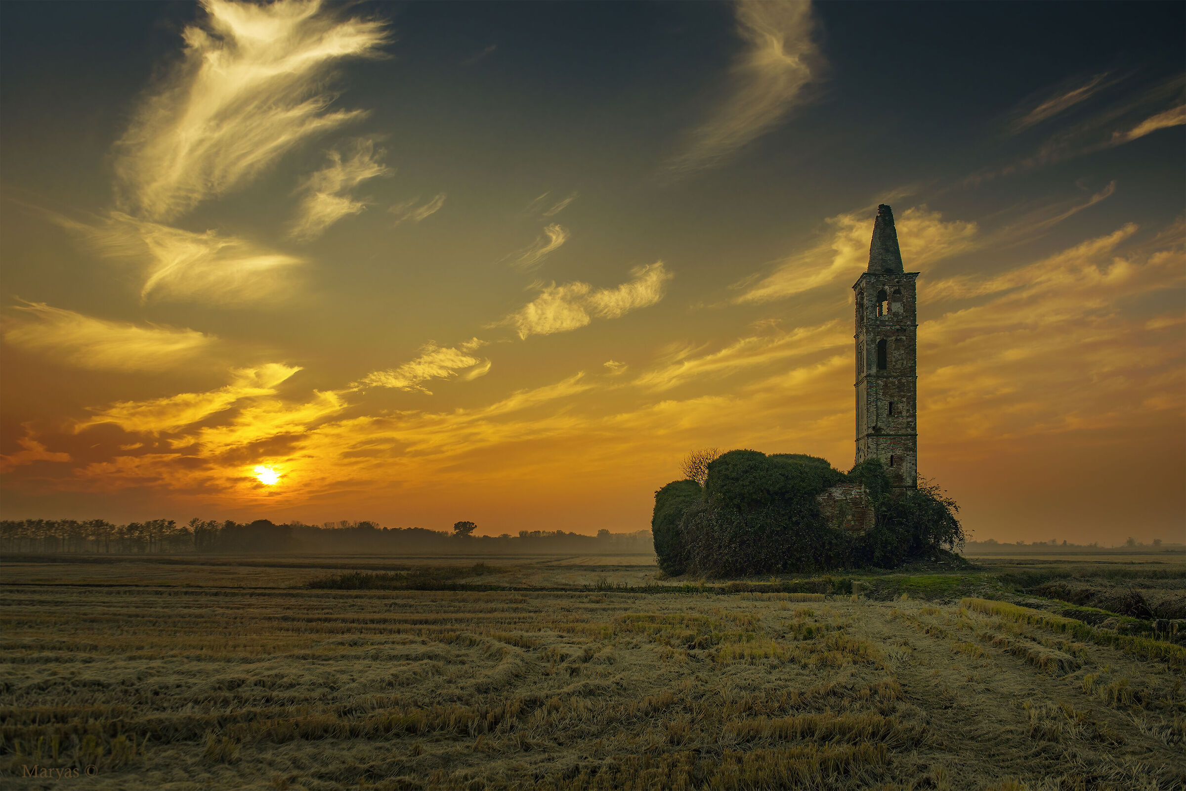The sunset of a bell tower...