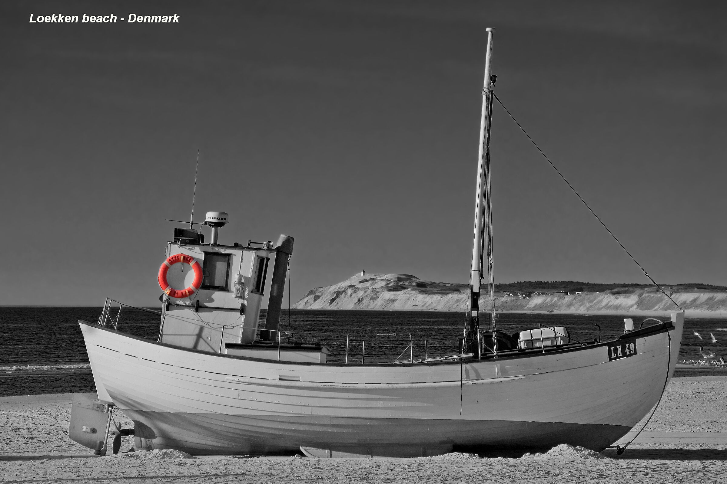 Fishing boat on the beach at Loekken - Denmark...