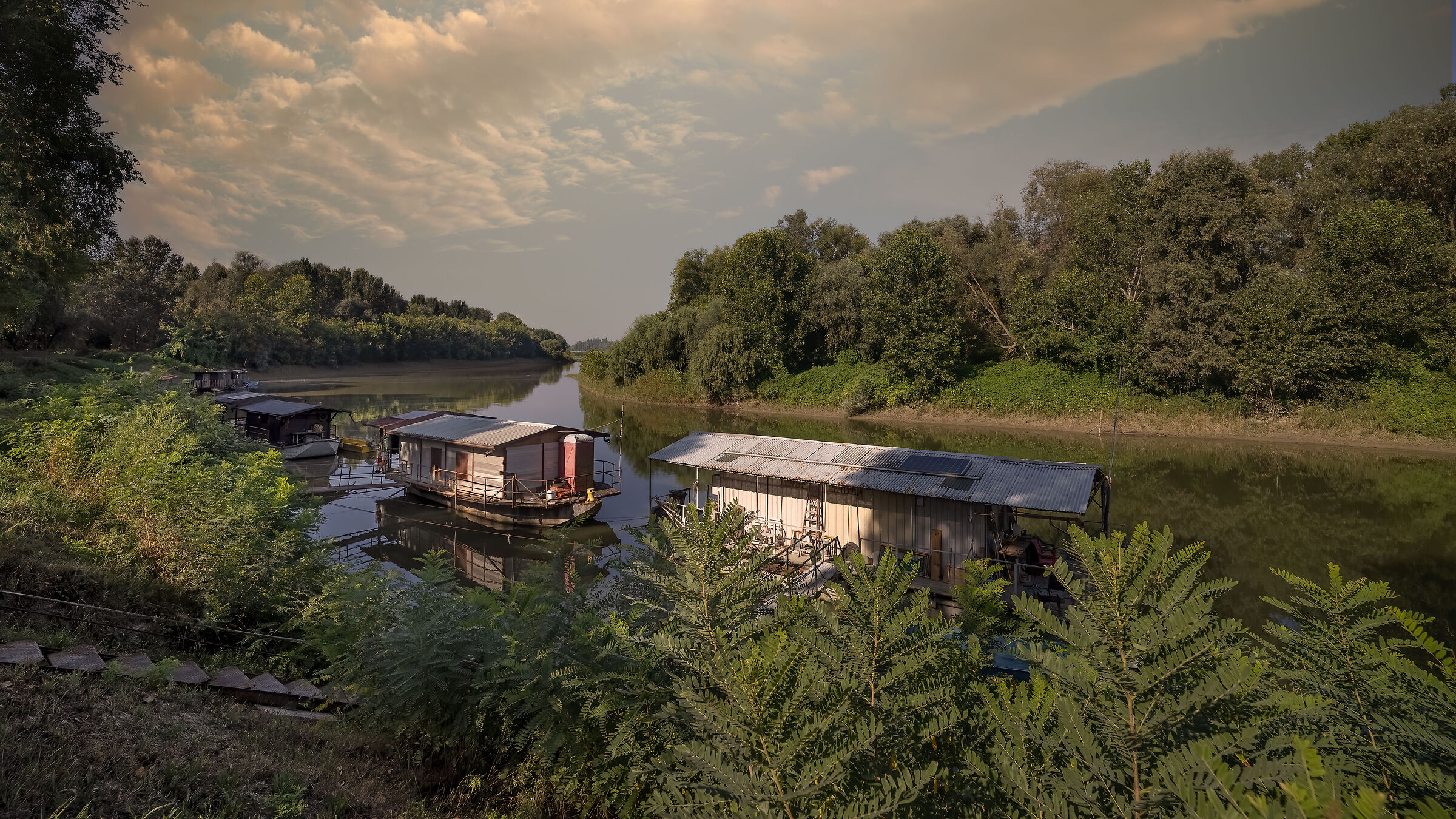 Houseboats in a quiet branch of the Po...