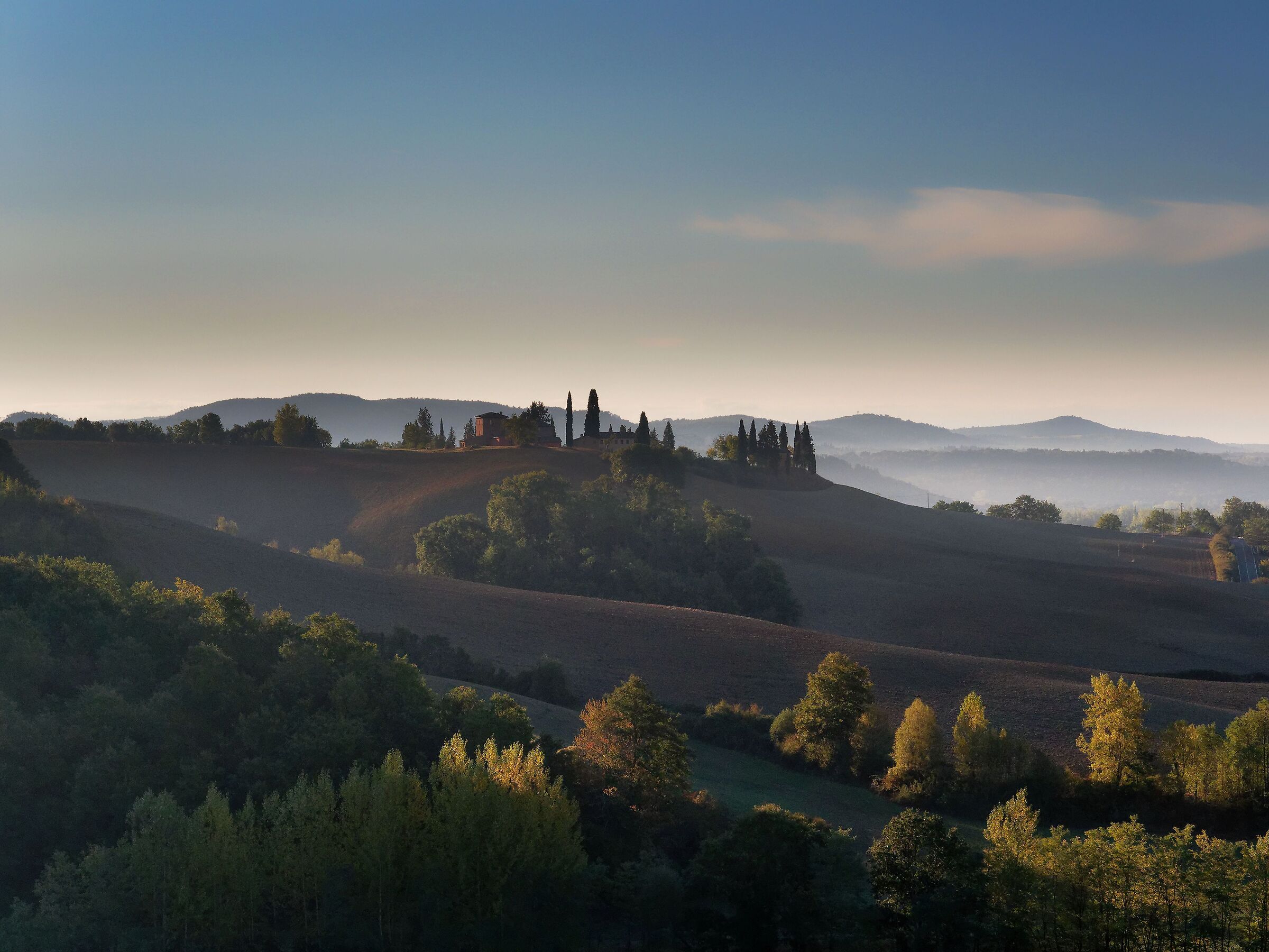 The first light that warms the Sienese hills...