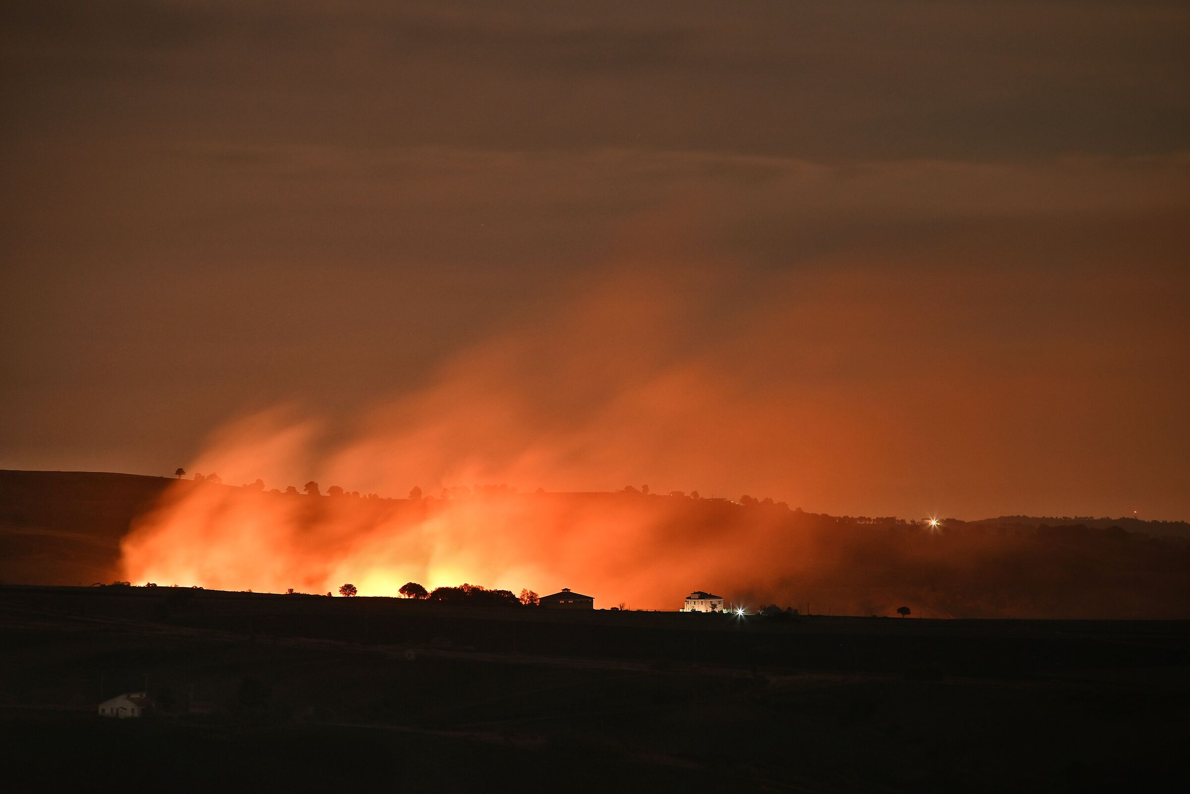 Fire in the night in the Calitrane countryside...
