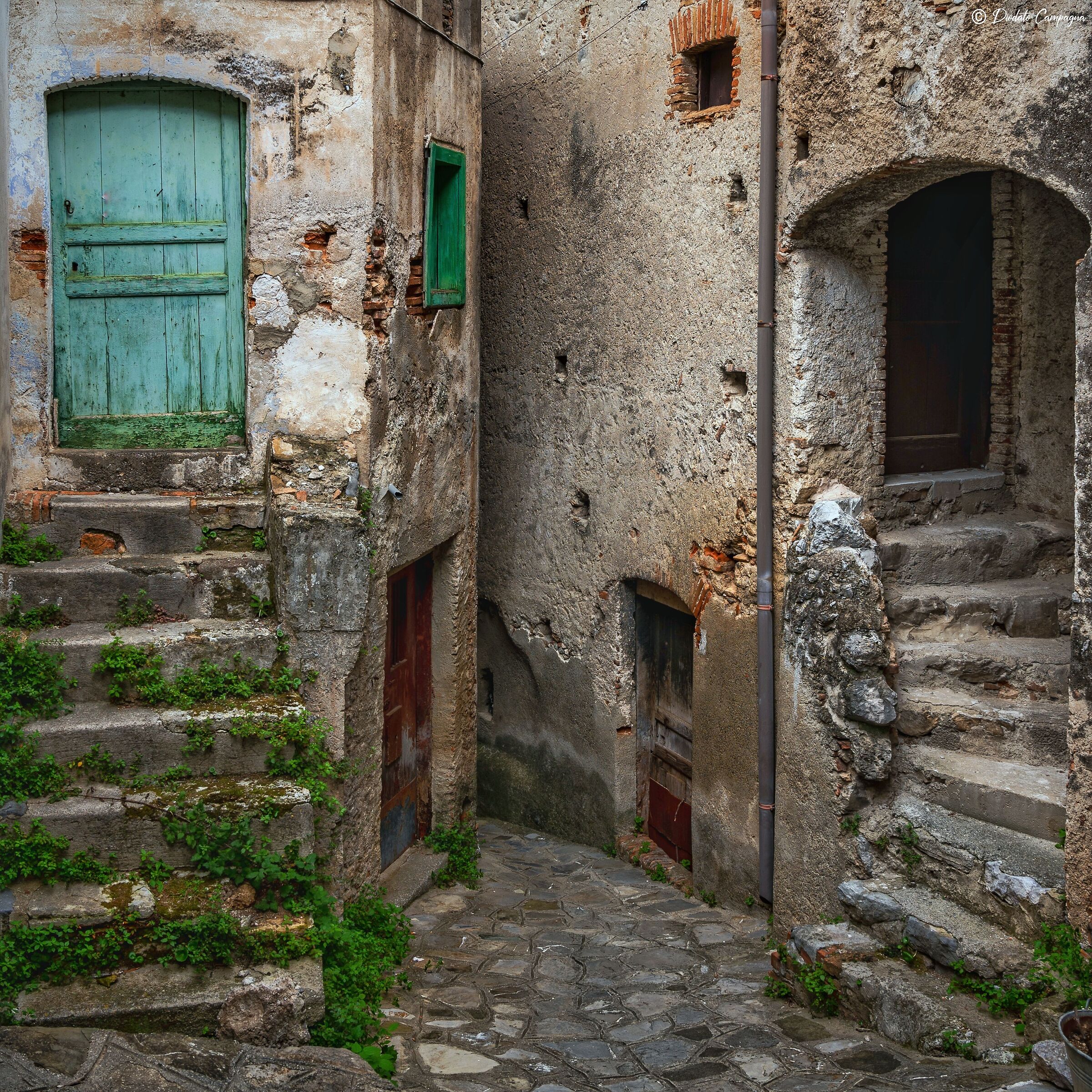 The narrow streets in the historic center of Civita...