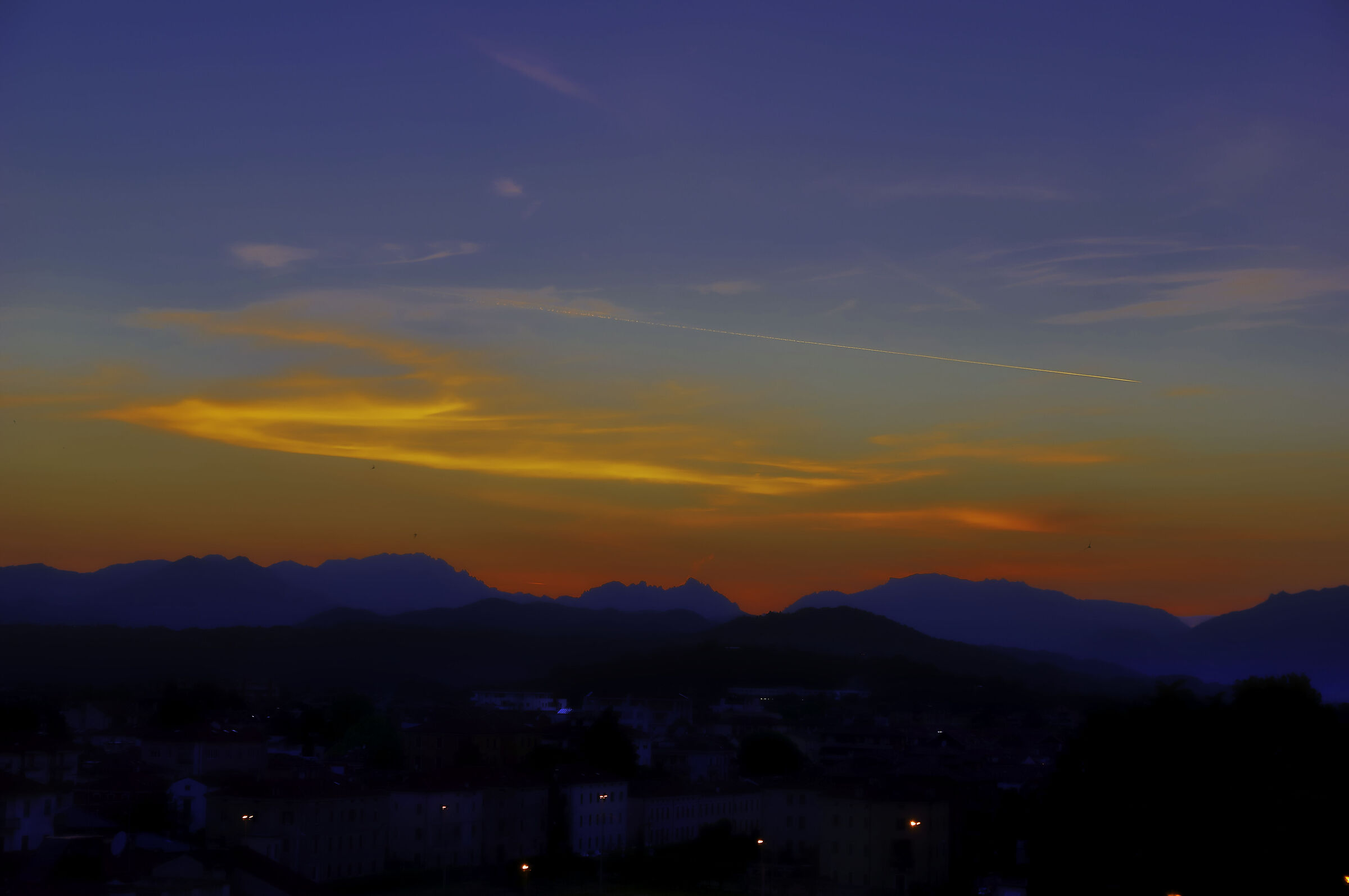 Sunset with airplane wake...