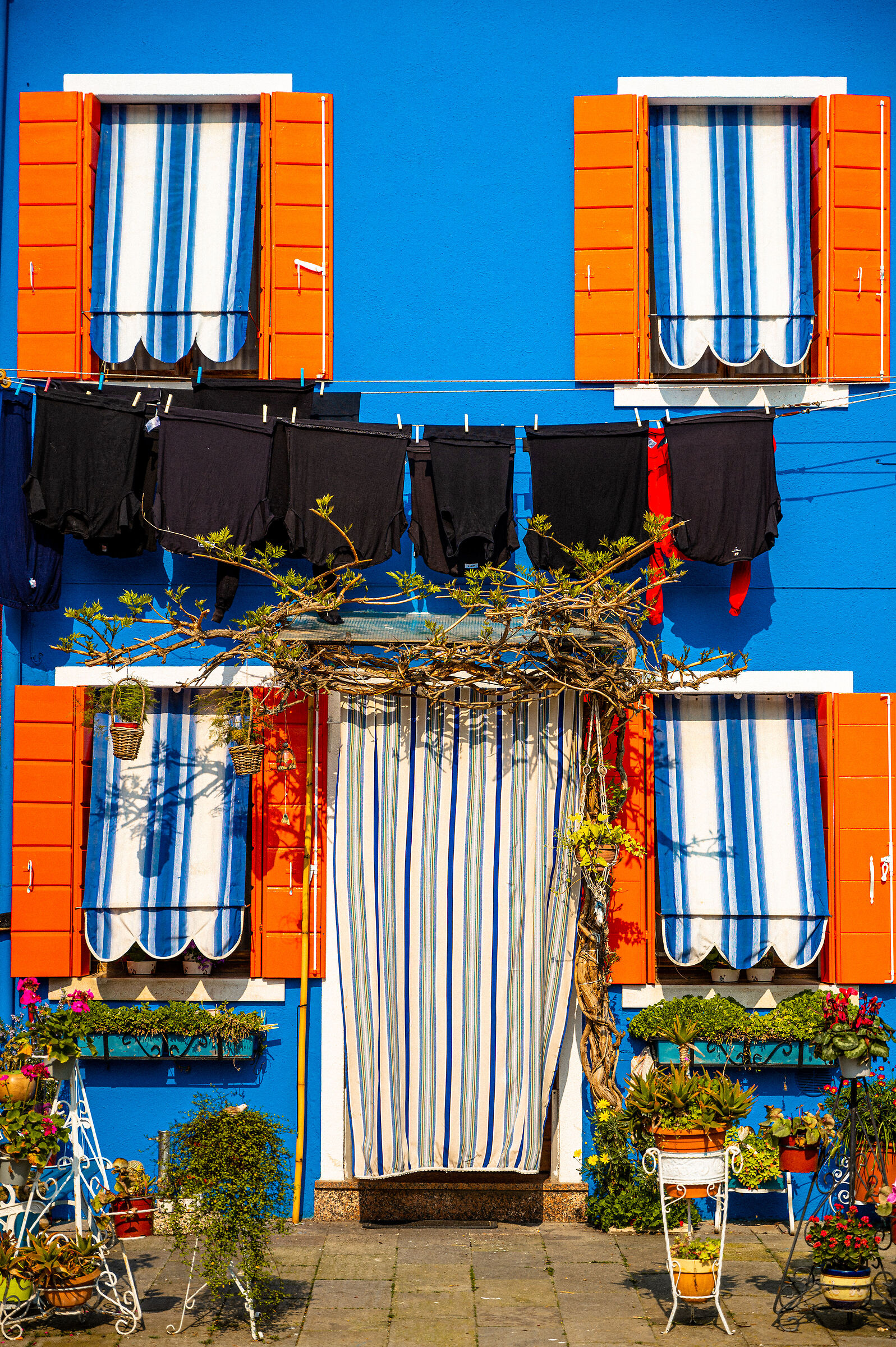 Blu house with orange windows close up...