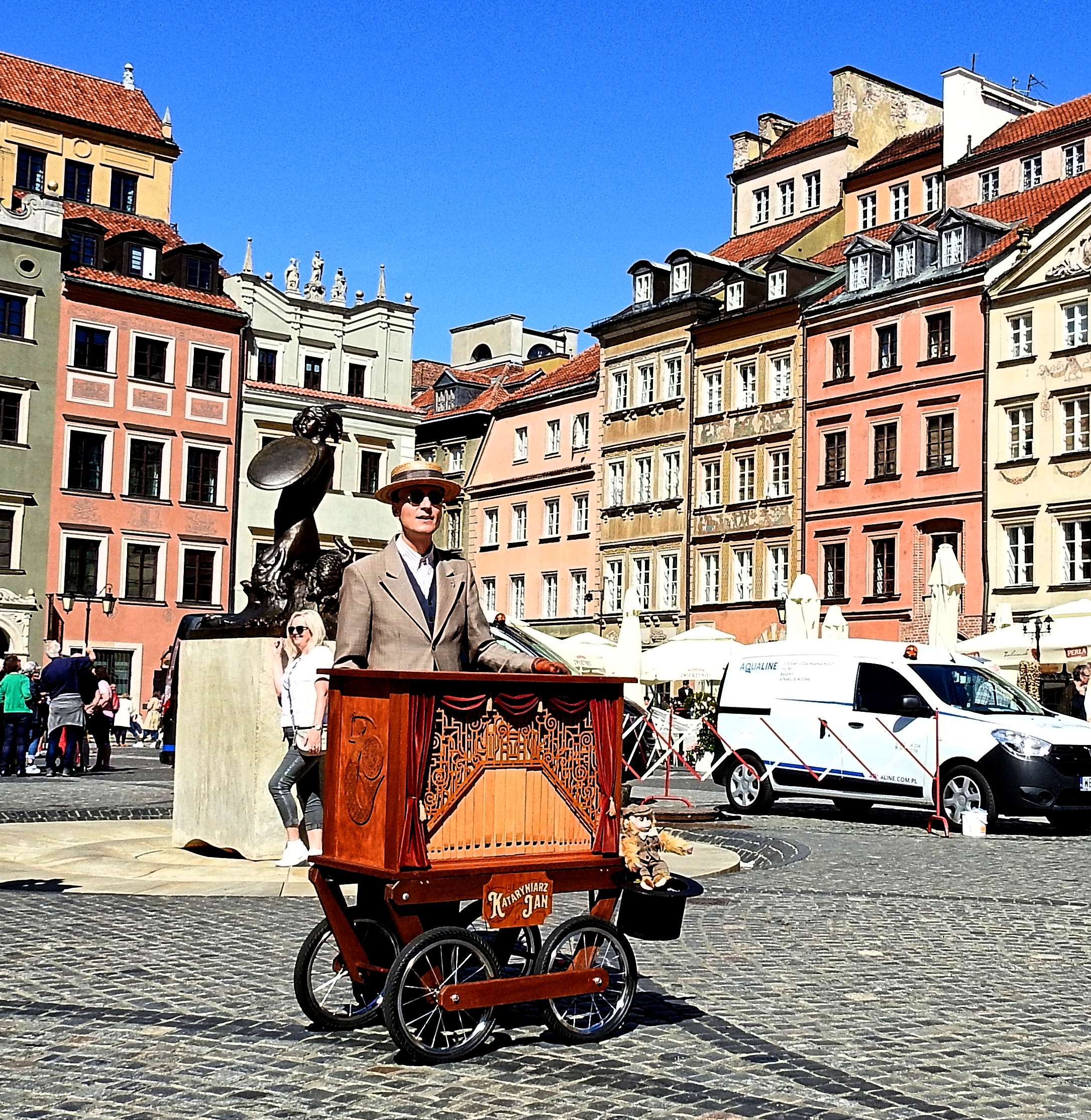 The Singer and his barrel organ/street...